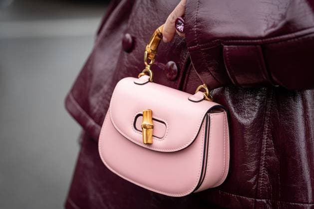 Street Style at Milan Fashion Week 2025 - Gucci in Milan, Italy on 25 February 2025 Street Style: A guest wears burgundy leather mini skirt, shiny leather jacket and pink Gucci bag outside of the Gucci fashion show during the Milan Fashion Week Womenswear Fall Winter 2025 2026 in Milan, Italy on 25 February 2025., Credit:Stefano Costantino TTL Avalon Milan, Italy  Copyright: xStefanoxCostantinoxTTLx xAvalonx 0968952809