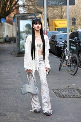 February 26, 2025, Milan, Lombardia, Italy: Milan Womens Fashion Week is taking place from February 25 to March 2, 2025. Fashionistas pose for photographers before the Diesel FW 2025-2026 fashion show. Milan Italy - ZUMAt227 20250226_zip_t227_001 Copyright: xMarinaxTakimotox