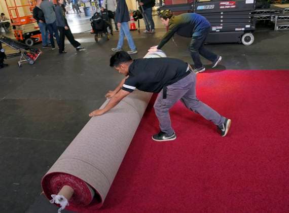 Crew members roll out the red carpet in preparation for the 97th Academy Awards in the Hollywood section of Los Angeles, California on Wednesday, February 26, 2025. Oscar winners will be announced during an ABC live telecast on March 2.  LAP2025022601 JIMxRUYMEN