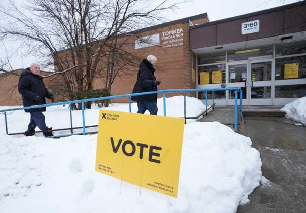 February 27, 2025, Mississauga, On, CANADA: People walk in to vote in the Ontario provincial election at a school in Mississauga, Ont., on Thursday, Feb. 27, 2025. Mississauga CANADA  - ZUMAc35_ 20250227_zaf_c35_001 Copyright: xNathanxDenettex