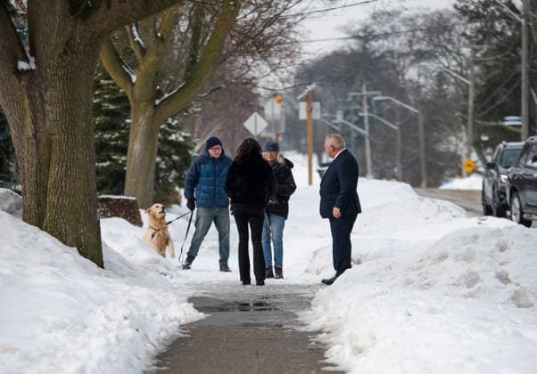 February 27, 2025, Etobicoke, On, Canada: Progressive Conservative Doug Ford and his wife Karla Ford talk to area residents as they arrive to cast their votes in the Ontario provincial election, at Westmount Junior School in Etobicoke, Ont., on Thursday, Feb. 27, 2025. Etobicoke Canada  - ZUMAc35_ 20250227_zaf_c35_004 Copyright: xLauraxProctorx