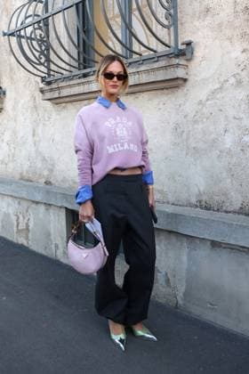 February 27, 2025, Milan, Lombardia, Italy: Milan Womens Fashion Week is taking place from February 25 to March 2, 2025. Fashionistas pose for photographers before the Prada FW 2025-2026 fashion show. Milan Italy - ZUMAt227 20250227_zip_t227_004 Copyright: xMarinaxTakimotox