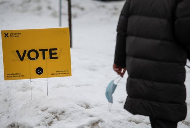 February 27, 2025, Etobicoke, On, Canada: A person carrying a mask leaves after voting in the Ontario provincial election at Westmount Junior School in Etobicoke, Ont., on Thursday, February 27, 2025. Etobicoke Canada  - ZUMAc35_ 20250227_zaf_c35_029 Copyright: xLauraxProctorx