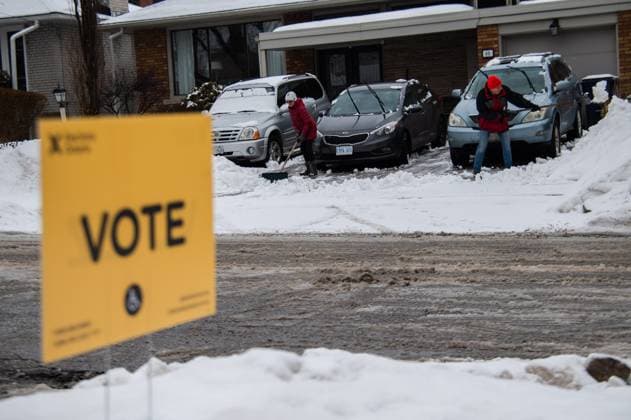 February 27, 2025, Etobicoke, On, Canada: Etobicoke residents shovel across the street from a polling station for the Ontario provincial election at Westmount Junior School in Etobicoke, Ont., on Thursday, February 27, 2025. Etobicoke Canada  - ZUMAc35_ 20250227_zaf_c35_031 Copyright: xLauraxProctorx