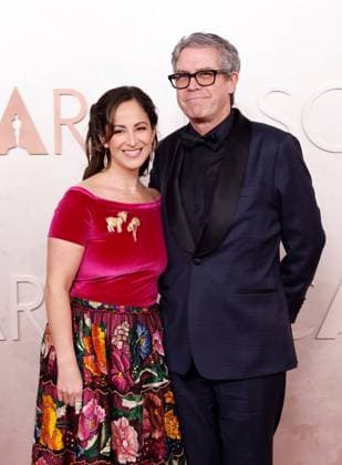 (L-R) Guest and John Powell arrive on the red carpet for the 97th Academy Awards in the Hollywood section of Los Angeles on Sunday, March 2, 2025.  LAP20250302744 JOHNxANGELILLO