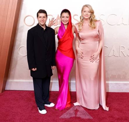 (L-R) Eric Nyari, Shiori Ito and Hanna Aqvilin arrive on the red carpet for the 97th Academy Awards in the Hollywood section of Los Angeles on Sunday, March 2, 2025.  LAP20250302747 JOHNxANGELILLO