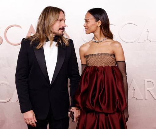 (L-R) Marco Perego-Saldana and Zoe Saldana arrive on the red carpet for the 97th Academy Awards in the Hollywood section of Los Angeles on Sunday, March 2, 2025.  LAP20250302790 JOHNxANGELILLO