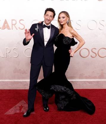 Adrien Brody and Georgina Chapman arrive on the red carpet for the 97th Academy Awards in the Hollywood section of Los Angeles on Sunday, March 2, 2025.  LAP20250302901 JOHNxANGELILLO