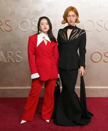 Kukombo (on the right) arrives on the red carpet for the 97th Academy Awards in the Hollywood section of Los Angeles on Sunday, March 2, 2025.  LAP20250302470 JIMxRUYMEN