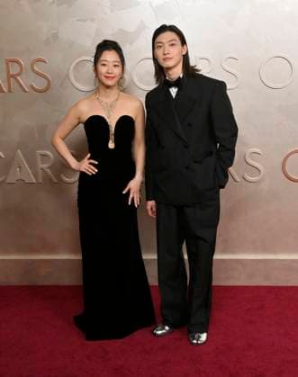 (L-R) Gia Kim and Sang Heon arrive on the red carpet for the 97th Academy Awards in the Hollywood section of Los Angeles on Sunday, March 2, 2025.  LAP20250302472 JIMxRUYMEN