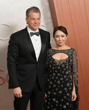 Greg Peters (on the left) arrives on the red carpet for the 97th Academy Awards in the Hollywood section of Los Angeles on Sunday, March 2, 2025.  LAP20250302480 JIMxRUYMEN