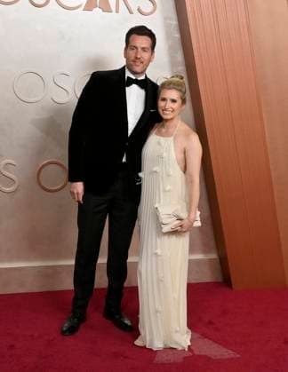 Jed Harmsen (on the left) arrives on the red carpet for the 97th Academy Awards in the Hollywood section of Los Angeles on Sunday, March 2, 2025.  LAP20250302495 JIMxRUYMEN