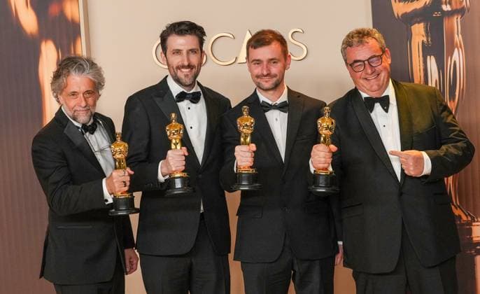 Paul Lambert, Stephen James, Rhys Salcombe, and Gerd Nefzer of Dune: Part Two celebrate backstage after winning the Oscar for best visual effects during the 97th Academy Awards in the Hollywood section of Los Angeles on Sunday, March 2, 2025.  LAP20250302139 PATxBENIC