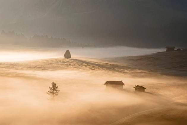 Aerial view of fog over mountain huts at fall, Seiser Alm Seis am Schlern, Trentino-South Tyrol, Italy CR_ROMO250228-1670632-01