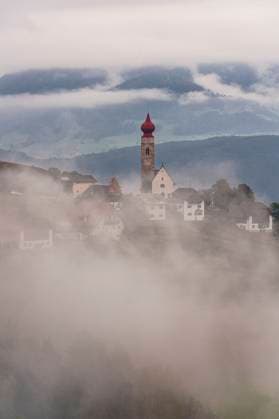 Alpine church in autumn fog, South Tyrol Longomoso, Trentino-South Tyrol, Italy R_ROMO250228-1670698-01