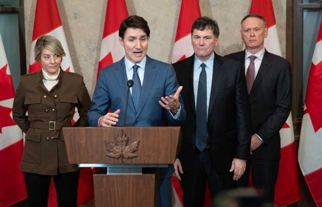 March 4, 2025, Ottawa, On, Canada: Prime Minister Justin Trudeau speaks about US imposed tariffs as Minister of Foreign Affairs Melanie Joly(left), Finance Minister Dominic LeBlanc and Public Safety Minister David McGuinty look on, Tuesday, Mar. 4, 2025 in Ottawa. Ottawa Canada  - ZUMAc35_ 20250304_zaf_c35_061 Copyright: xAdrianxWyldx