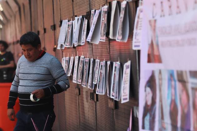 Members of collectives of searching mothers paste banners of missing girls during a demonstration to demand justice for their missing relatives as part of the International Women s Day outside the National Palace. on March 5, 2025 in Mexico City, Mexico. Mexico City Mexico - ZUMAe321 20250305_zia_e321_047 Copyright: xCarlosxSantiagox
