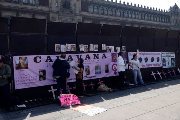 Collectives of mothers of missing persons paste posters of the victims of femicide in the main square Zocalo demanding justice for all femicides in Mexico prior to International Women s Day. on March 5, 2025 in Mexico City, Mexico. Mexico City Mexico - ZUMAe321 20250305_zia_e321_088 Copyright: xLuisxBarronx