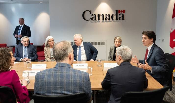 March 7, 2025, Montreal, Pq, CANADA: Prime Minister Justin Trudeau, right, flanked by from left to right, Michael Sabia, president and CEO, Hydro-Quebec, Isabelle Hudon, president of the Business Development Bank of Canada (BDC) Jean Charest, member of his council on Canada-U.S. relations, Foreign Affairs Minister Melanie Joly, Minister of Innovation, Science and Industry Francois-Philippe Champagne and Martin Caron, president of L Union des producteurs agricoles (UPA) and Veronique Proulx, president and CEO of Federation des chambres de commerce du Quebec (FCCQ), hosts a round table with business community leaders in Montreal on Friday, March 7, 2025. Montreal CANADA - ZUMAc35_ 20250307_zaf_c35_046 Copyright: xChristinnexMuschix