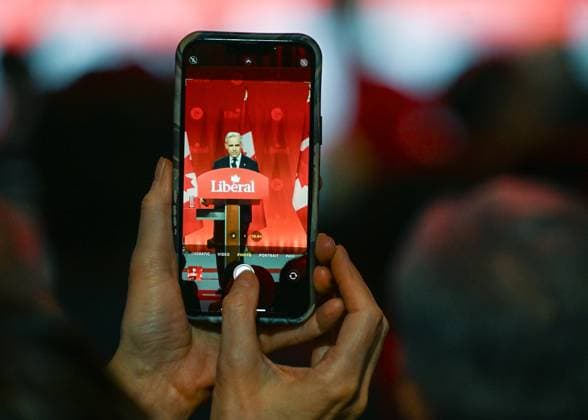 2025 Liberal Leadership Election Results Announcement In Ottawa OTTAWA, CANADA MARCH 9: A supporter take a photo of Mark Carney, the newly elected leader of the Liberal Party of Canada, addressing the crowd in a victory speech after the official announcement of the 2025 Liberal Leadership race results at Rogers Centre, in Ottawa, Ontario, Canada, on March 9, 2025. Ottawa Canada  Copyright: xArturxWidakx originalFilename: widak-2025libe250309_np1oE.jpg