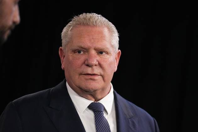 March 10, 2025, Toronto, On, CAN: Ontario Premier Doug Ford looks over at Ontario Minister of Energy Stephen Lecce as he speaks to the media at the Queens Park Legislature in Toronto, on Monday, March 10, 2025. Toronto CAN  - ZUMAc35_ 20250310_zaf_c35_029 Copyright: xChrisxYoungx