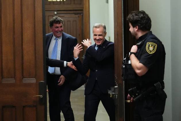 March 10, 2025, Ottawa, On, Canada: Liberal Leader Mark Carney (right) smiles as he tries to get past Finance Minister Dominic LeBlanc to leave a caucus meeting in Ottawa, Monday, March 10, 2025. Ottawa Canada  - ZUMAc35_ 20250310_zaf_c35_062 Copyright: xSeanxKilpatrickx