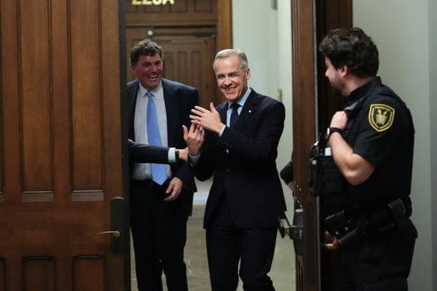 March 10, 2025, Ottawa, On, Canada: Liberal Leader Mark Carney (right) smiles as he tries to get past Finance Minister Dominic LeBlanc to leave a caucus meeting in Ottawa, Monday, March 10, 2025. Ottawa Canada  - ZUMAc35_ 20250310_zaf_c35_063 Copyright: xSeanxKilpatrickx