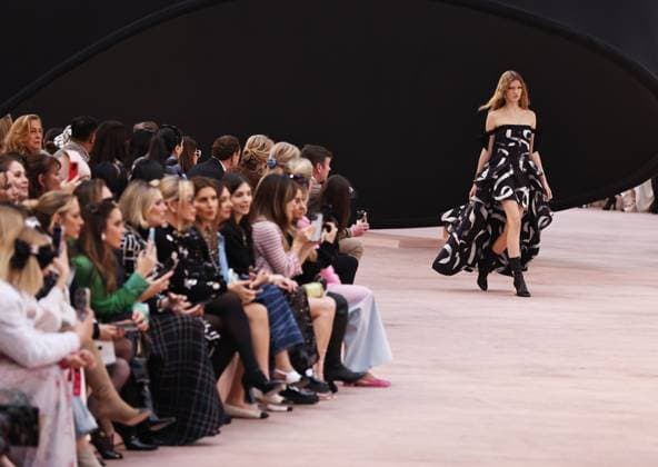 (250311) -- PARIS, March 11, 2025 -- A model presents a creation of the ready-to-wear Fall Winter 2025-2026 collections by French fashion house Chanel during the Paris Fashion Week, in Paris, France, on March 11, 2025. ) FRANCE-PARIS-FASHION WEEK-CHANEL GaoxJing 