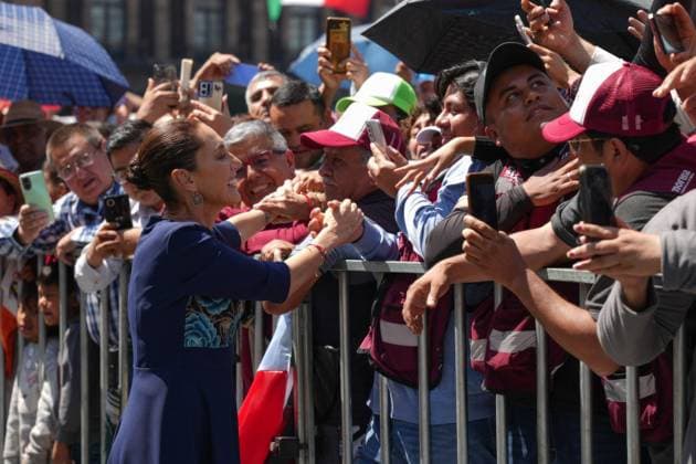 March 9, 2025, Mexico City, Df, Mexico: Mexican President Claudia Sheinbaum, greets supporters after addressing a rally celebrating Mexico in the trade war with the United States at the ZoÂ³calo, March 9, 2025 in Mexico City, Mexico. An estimated 350,000 Mexicans attended the rally. Mexico City Mexico - ZUMAp138 20250309_zaa_p138_008 Copyright: xPresidencia MexicanxPresidentsx