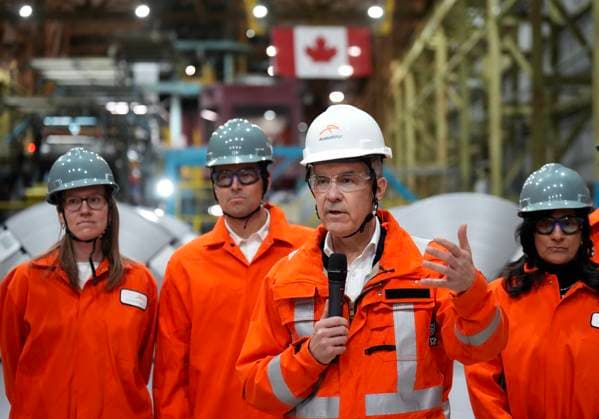 March 12, 2025, Hamilton, On, CANADA: Canadian Prime Minister designate Mark Carney, second right, speaks to steel workers after touring the ArcelorMittal Dofasco steel plant in Hamilton, Ont., on Wednesday, March 12, 2025. Hamilton CANADA - ZUMAc35_ 20250312_zaf_c35_062 Copyright: xNathanxDenettex