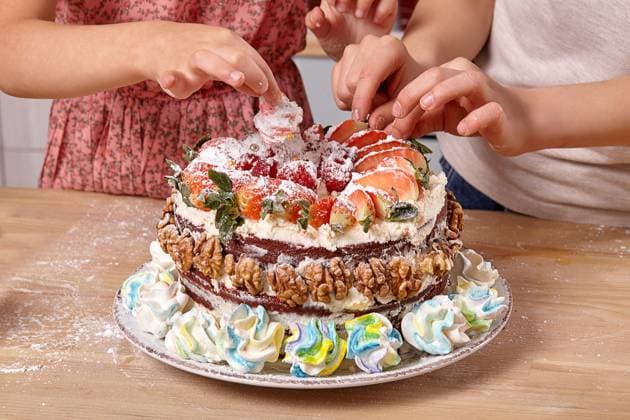 Little boy dressed in a light t-shirt and jeans and a girl wearing in a pink dress are making a cake at a kitchen. They are decorating the cake with some strawberry., model released, , 53269662.jpg, girl, boy, cake, child, cooking, flour, preparation, young, pretty, funny, home, kitchen, smile, background, studio, pie, sweet, little, indoor, fruits, children, interior, meal, marshmallow, table, colorful, furniture, wooden, t-shirt, jeans, dress, strawberry, braid, ingredients, raspberry, fresh, culinary, plate, childhood, powdered sugar, cheese, walnuts, dish, glass, orange, cream, male, female, kids, decorating RECORD DATE NOT STATED