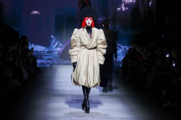 RUSSIA, MOSCOW - MARCH 13, 2025: A woman models one of the creations during a runway show for the Moscow Art and Industry Institute collection as part of the 4th Moscow Fashion Week at the Manege Central Exhibition Hall (Moscow Manege). Yevgeny Messman TASS  79070394