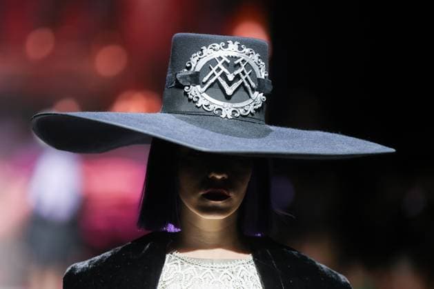 RUSSIA, MOSCOW - MARCH 13, 2025: A woman models one of the creations during a runway show for the Moscow Art and Industry Institute collection as part of the 4th Moscow Fashion Week at the Manege Central Exhibition Hall (Moscow Manege). Yevgeny Messman TASS  79070395