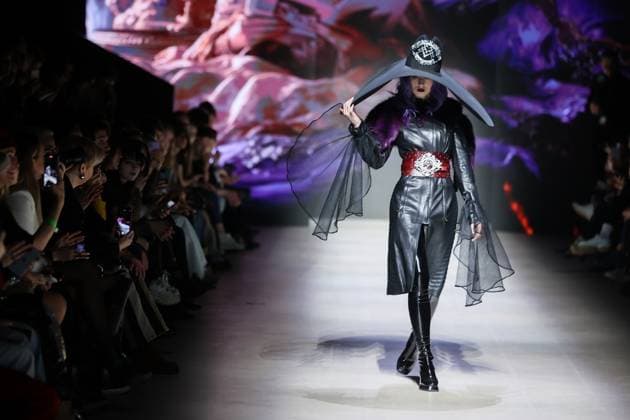 RUSSIA, MOSCOW - MARCH 13, 2025: A woman models one of the creations during a runway show for the Moscow Art and Industry Institute collection as part of the 4th Moscow Fashion Week at the Manege Central Exhibition Hall (Moscow Manege). Yevgeny Messman TASS  79070391