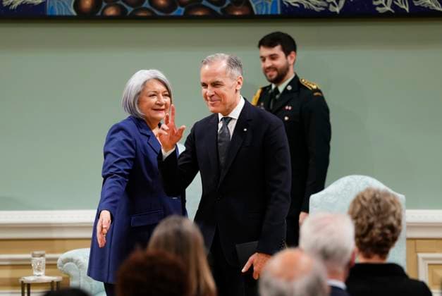 March 14, 2025, Ottawa, On, Canada: Prime Minister Mark Carney waves after being sworn in as Gov. Gen. Mary Simon looks on at Rideau Hall in Ottawa on Friday, March 14, 2025. Ottawa Canada  - ZUMAc35_ 20250314_zaf_c35_085 Copyright: xJustinxTangx