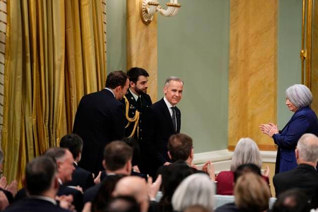 March 14, 2025, Ottawa, On, Canada: Prime Minister Mark Carney looks toward members of his cabinet after being sworn in at Rideau Hall in Ottawa on Friday, March 14, 2025. Ottawa Canada  - ZUMAc35_ 20250314_zaf_c35_087 Copyright: xJustinxTangx