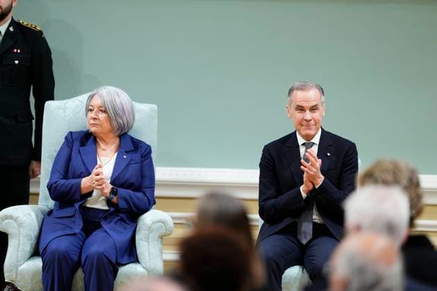 March 14, 2025, Ottawa, On, Canada: Prime Minister Mark Carney applauds and looks toward members of his family after being sworn in at Rideau Hall in Ottawa on Friday, March 14, 2025. Ottawa Canada  - ZUMAc35_ 20250314_zaf_c35_102 Copyright: xJustinxTangx
