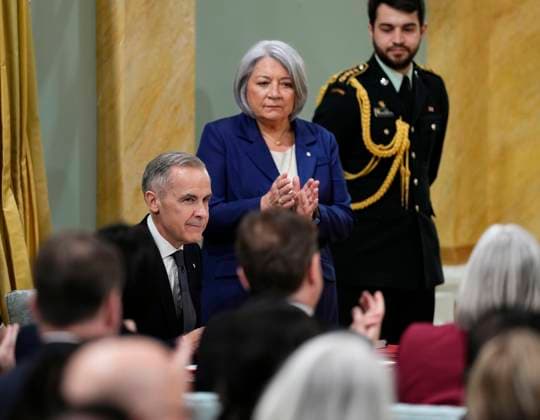 March 14, 2025, Ottawa, On, Canada: Prime Minister Mark Carney looks up after signing a document in front of Gov. Gen. Mary Simon after being sworn in at Rideau Hall in Ottawa on Friday, March 14, 2025. Ottawa Canada  - ZUMAc35_ 20250314_zaf_c35_103 Copyright: xJustinxTangx