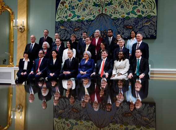 March 14, 2025, Ottawa, On, Canada: Prime Minister Mark Carney, Gov. Gen. Mary Simon and members of the Liberal cabinet are reflected in a glass table as they pose for a family photo after a swearing in ceremony at Rideau Hall in Ottawa on Friday, March 14, 2025. Ottawa Canada  - ZUMAc35_ 20250314_zaf_c35_124 Copyright: xJustinxTangx