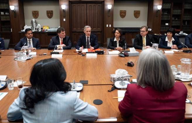 March 14, 2025, Ottawa, On, Canada: Prime Minister Mark Carney speaks with members of cabinet on Parliament Hill on Friday, March 14, 2025 in Ottawa. Ottawa Canada  - ZUMAc35_ 20250314_zaf_c35_227 Copyright: xAdrianxWyldx