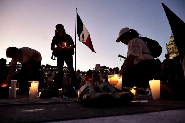 March 15, 2025, Mexico City, Cdmx, Mexico: In recent days, a training and extermination camp was discovered in Teuchitlan, Jalisco. The Rancho Izaguirre, which was discovered and secured by federal forces, belongs to the Jalisco New Generation Cartel (CJNG). For this reason, groups searching for missing persons called for a nationwide vigil in memory of the victims and missing persons from all over Mexico. Constitution Plaza in Mexico City was the designated location for the placement of 400 shoes and candles to express their outrage at the government s lack of response and solution. Mexico City Mexico - ZUMAp204 20250315_zip_p204_050 Copyright: xJosuexPerezx