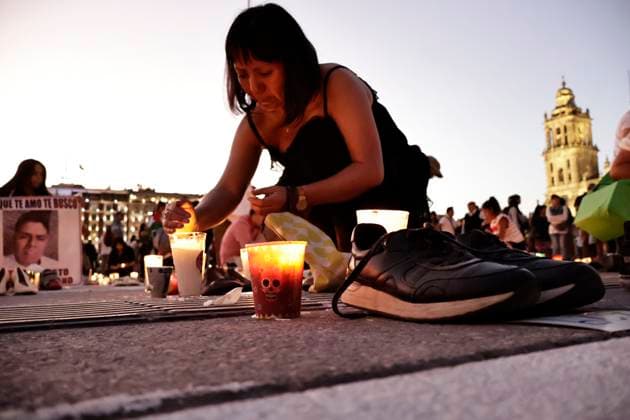 March 15, 2025, Mexico City, Cdmx, Mexico: In recent days, a training and extermination camp was discovered in Teuchitlan, Jalisco. The Rancho Izaguirre, which was discovered and secured by federal forces, belongs to the Jalisco New Generation Cartel (CJNG). For this reason, groups searching for missing persons called for a nationwide vigil in memory of the victims and missing persons from all over Mexico. Constitution Plaza in Mexico City was the designated location for the placement of 400 shoes and candles to express their outrage at the government s lack of response and solution. Mexico City Mexico - ZUMAp204 20250315_zip_p204_063 Copyright: xJosuexPerezx