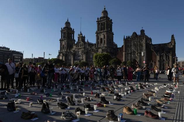 March 16, 2025, Mexico City, Mexico: Relatives of missing persons, organizations and individuals called for a day of national mourning for the discovery of an extermination camp in TeuchitloÂ¡n, Jalisco. In Mexico City, protesters placed shoes and candles in the main square, in front of the National Palace. Mexico City Mexico - ZUMAl178 20250316_znp_l178_021 Copyright: xCristianxLeyvax