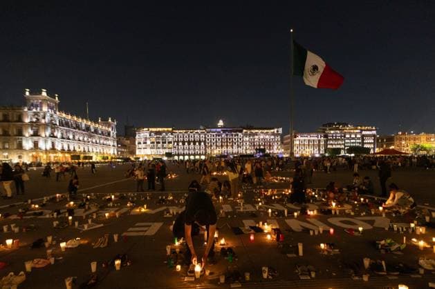 March 16, 2025, Mexico City, Mexico: Relatives of missing persons, organizations and individuals called for a day of national mourning for the discovery of an extermination camp in TeuchitloÂ¡n, Jalisco. In Mexico City, protesters placed shoes and candles in the main square, in front of the National Palace. Mexico City Mexico - ZUMAl178 20250316_znp_l178_055 Copyright: xCristianxLeyvax