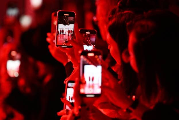 Russia Moscow Fashion Week 8880344 16.03.2025 Visitors film the presentation of creations by the brand COSAREVE during the 4th Moscow Fashion Week at the Manege Central Exhibition Hall in Moscow, Russia. Grigory Sysoev Sputnik Moscow Russia  Copyright: xGrigoryxSysoevx