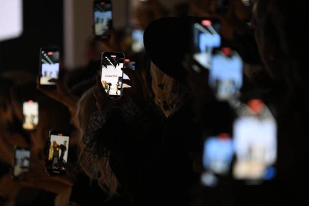 Russia Moscow Fashion Week 8880354 16.03.2025 Visitors film the presentation of creations by the brand COSAREVE during the 4th Moscow Fashion Week at the Manege Central Exhibition Hall in Moscow, Russia. Grigory Sysoev Sputnik Moscow Russia  Copyright: xGrigoryxSysoevx