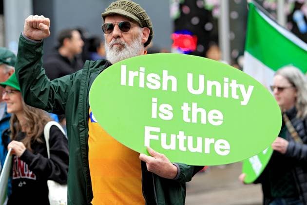 St. Patrick s Day Parade In Downtown Toronto, Canada, On March 16, 2025. A parade participant holds a sign that says Irish Unity is the Future during the St. Patrick s Day parade in Toronto, Canada, on March 16, 2025. Toronto Canada  Copyright: xMikexCampbellx originalFilename: campbell-notitle250317_npS2X.jpg