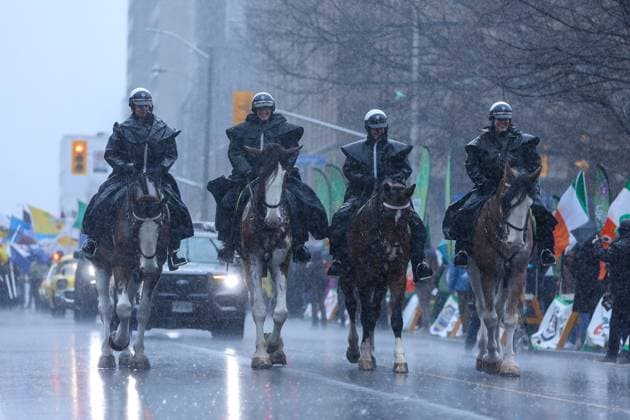 2025 Toronto St. Patrick s Day Parade Police officers on their horses smile under heavy rain while opening the parade during the 2025 Toronto St. Patrick s Day Parade in Toronto, Ontario, Canada, on March 16, 2025. Toronto Ontario Canada  Copyright: xIndrawanxKumalax originalFilename: kumala-2025toro250316_npqWq.jpg