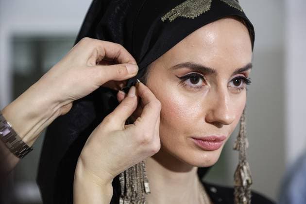RUSSIA, MOSCOW - MARCH 18, 2025: A model prepares for a runway show for the collection by Bouzma ethnique as part of the 4th Moscow Fashion Week at the Manege Central Exhibition Hall. Valery Sharifulin TASS  79200154
