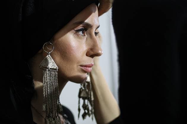 RUSSIA, MOSCOW - MARCH 18, 2025: A model prepares for a runway show for the collection by Bouzma ethnique as part of the 4th Moscow Fashion Week at the Manege Central Exhibition Hall. Valery Sharifulin TASS  79200156